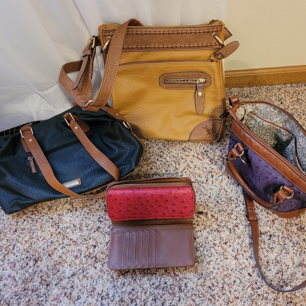 Three hand bags and a coin purse.  The tan bag is new.